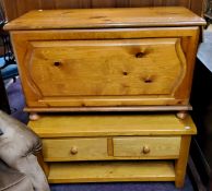 A modern golden oak rounded rectangular coffee table; a pine toy chest (2)