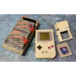 Retro gaming - a Nintendo Gameboy (missing battery cover), Tetris game cartridge, a Nuby Game Light;