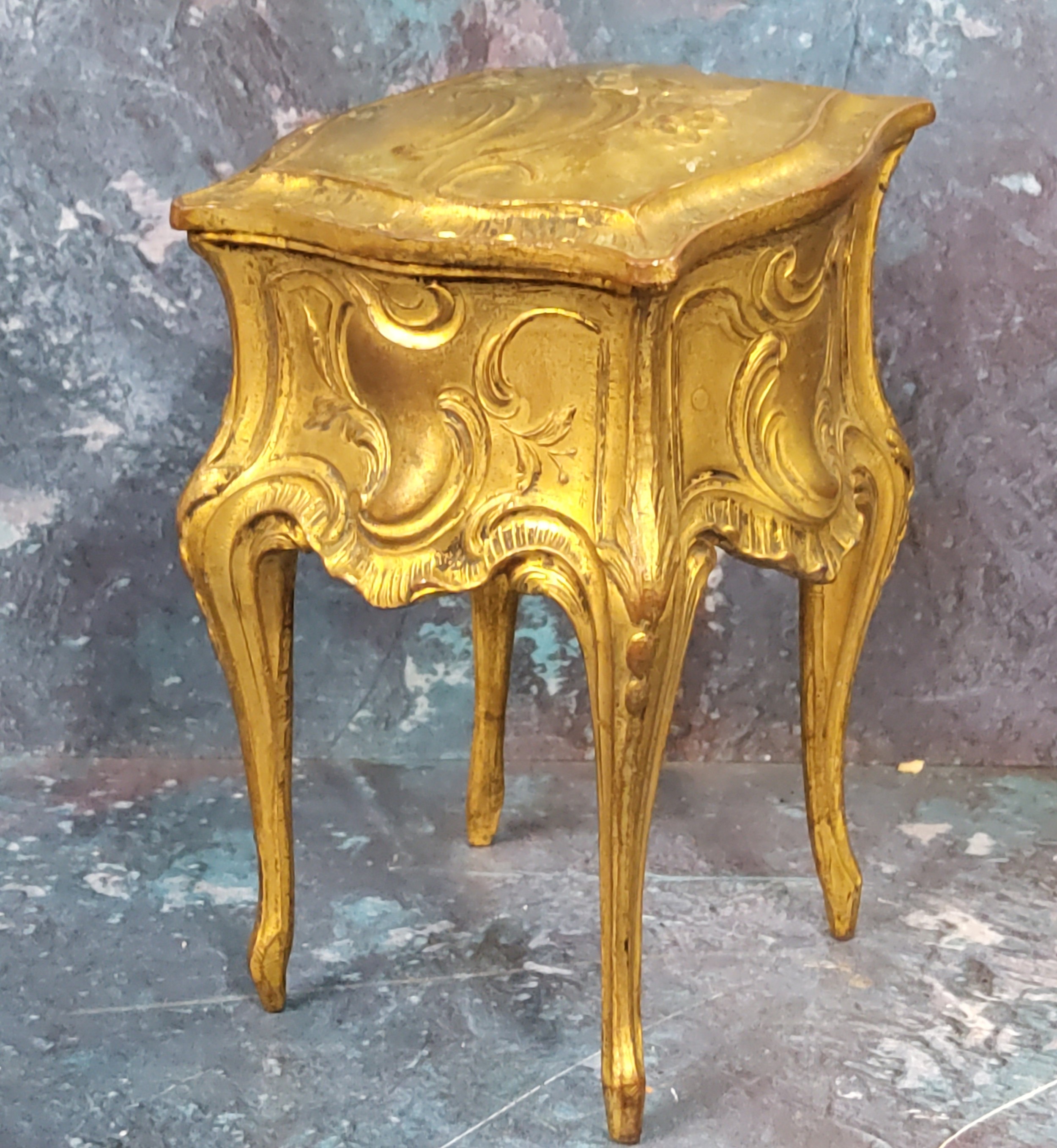 An early 20th-century French gilt metal casket, in the form of a bureau de dame, cast with