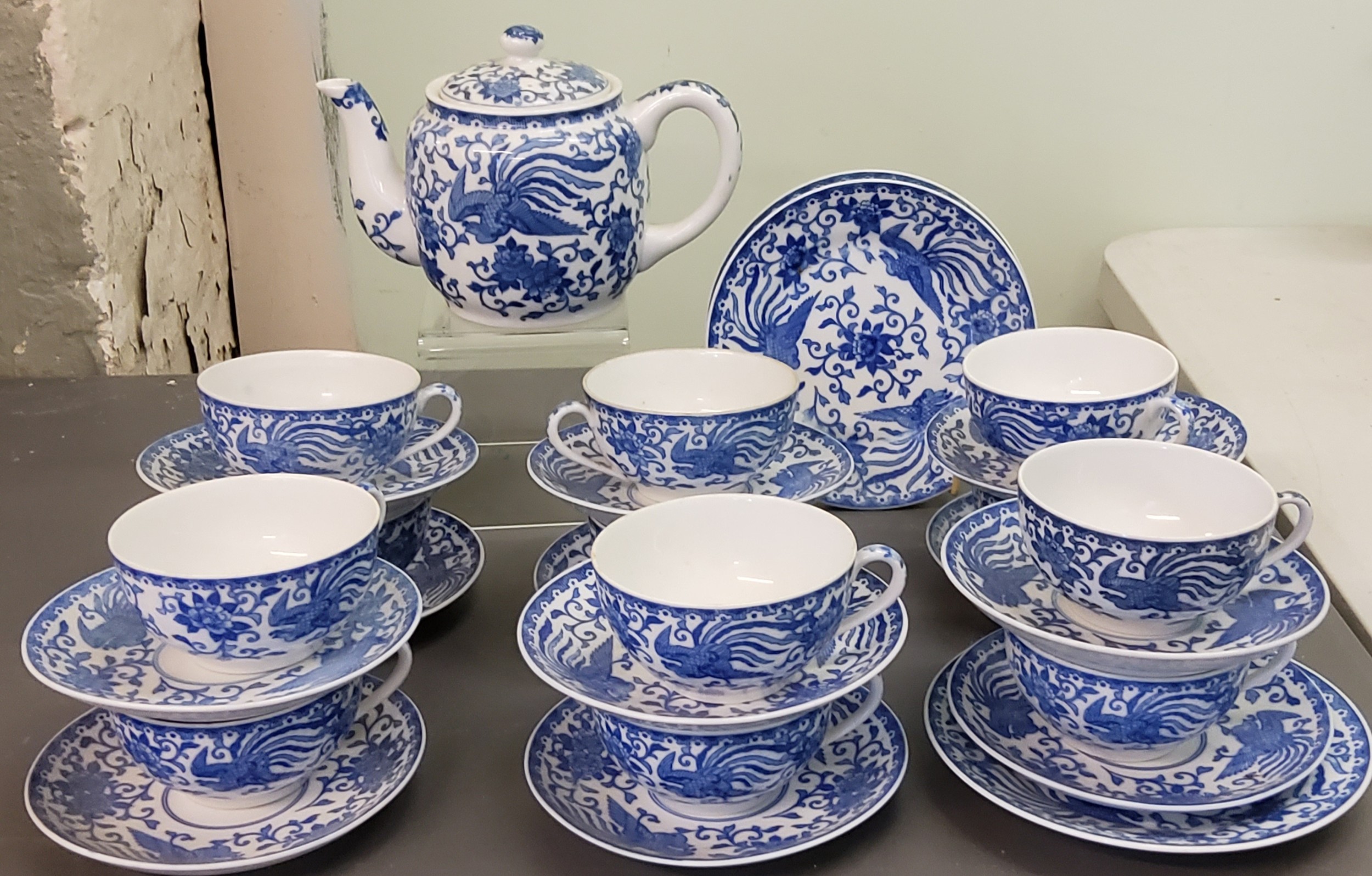 A Noritake tea service, for twelve, comprising teacups and saucers, teapot and two side plates, each