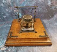 A Victorian oak inkstand, with waterfall pen rest, square well, square base, 21cm wide, c.1870