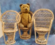 Three wicker doll's wicker chairs, 40cm high;  a jointed teddy bear, straw-filled, 43cm high
