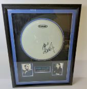 Robbie Williams a signed framed drum skin mounted with images and title, certificate of authenticity