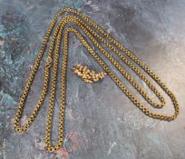 A yellow metal muff/guard chain, 152cms long, 31.5g; a yellow metal brooch in the form of a