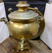 A brass samovar, of ovoid form, square stand, 47cm high;  a brass circular tray (2)