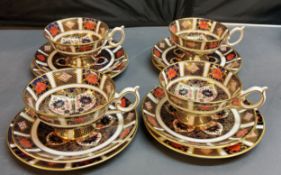 A set of four Royal Crown Derby 1128 pattern pedestal teacups and saucers, printed marks