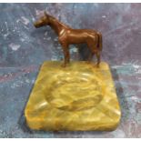 An Austrian onyx and bronze ashtray, surmounted with horse, 14cm wide, 11cm high, c.1930