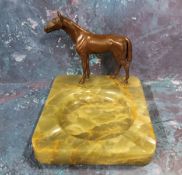 An Austrian onyx and bronze ashtray, surmounted with horse, 14cm wide, 11cm high, c.1930