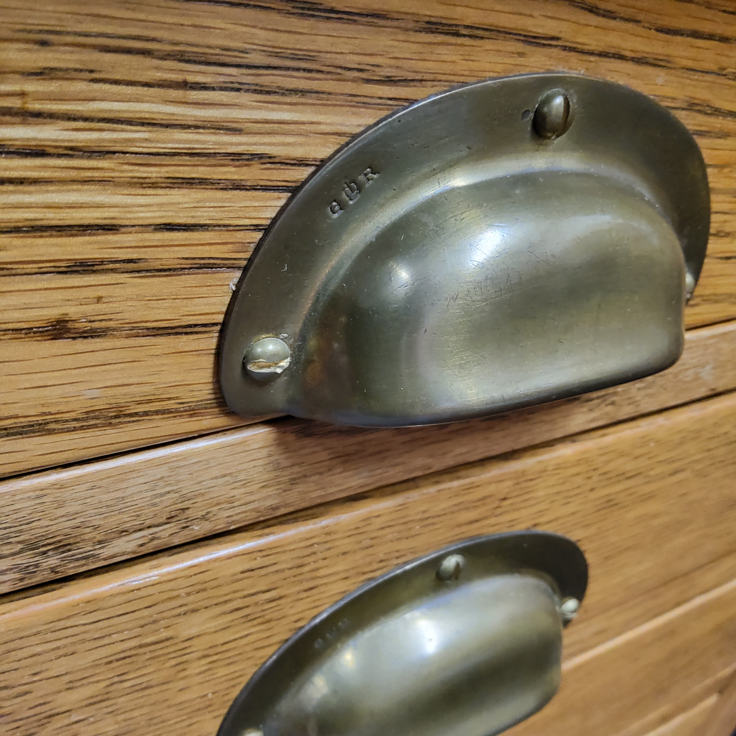 An early 20th century light oak deep bank of five drawers, brass cup handles stamped 'GR' for - Image 3 of 4