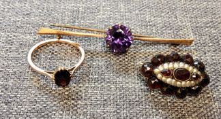 A 9ct gold and Ruby ring; Victorian garnet and seed pearl brooch; a rose 'gold' coloured garnet