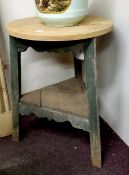 A 19th century farmhouse pine cricket table, stained green, undershelf, shaped apron, 76cm high,