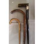 An ebonised walking stick, horn handle, silver collar, Chester 1901;  an early 20th century bamboo