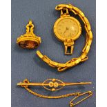 A lady's 9ct gold plated watch;  a gold coloured metal fob, purple stone;  a gold coloured metal