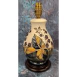 A Moorcroft Leaf Berries pattern baluster vase, tube lined contemporary with blackberries and