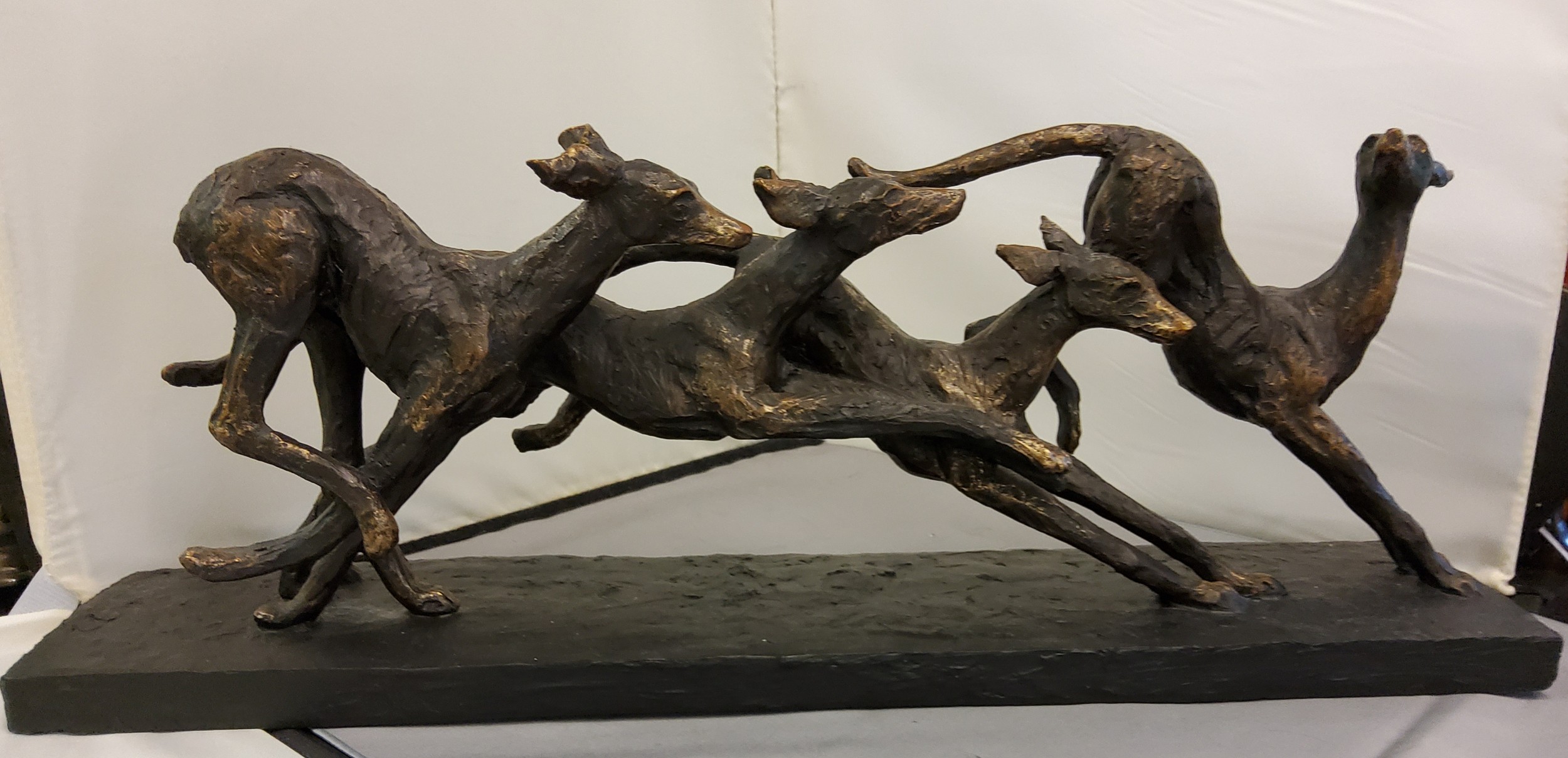 Libra Company, bronzed resin, Grey Hounds Running, rectangular base, 53cm long (AF)