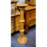 A modern oak torchere / plinth, fluted column with stepped base, 97cm high x 22cm diameter