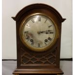 A late 19th century mahogany mantel clock, with Roman numerals, twin winding holes, eight day