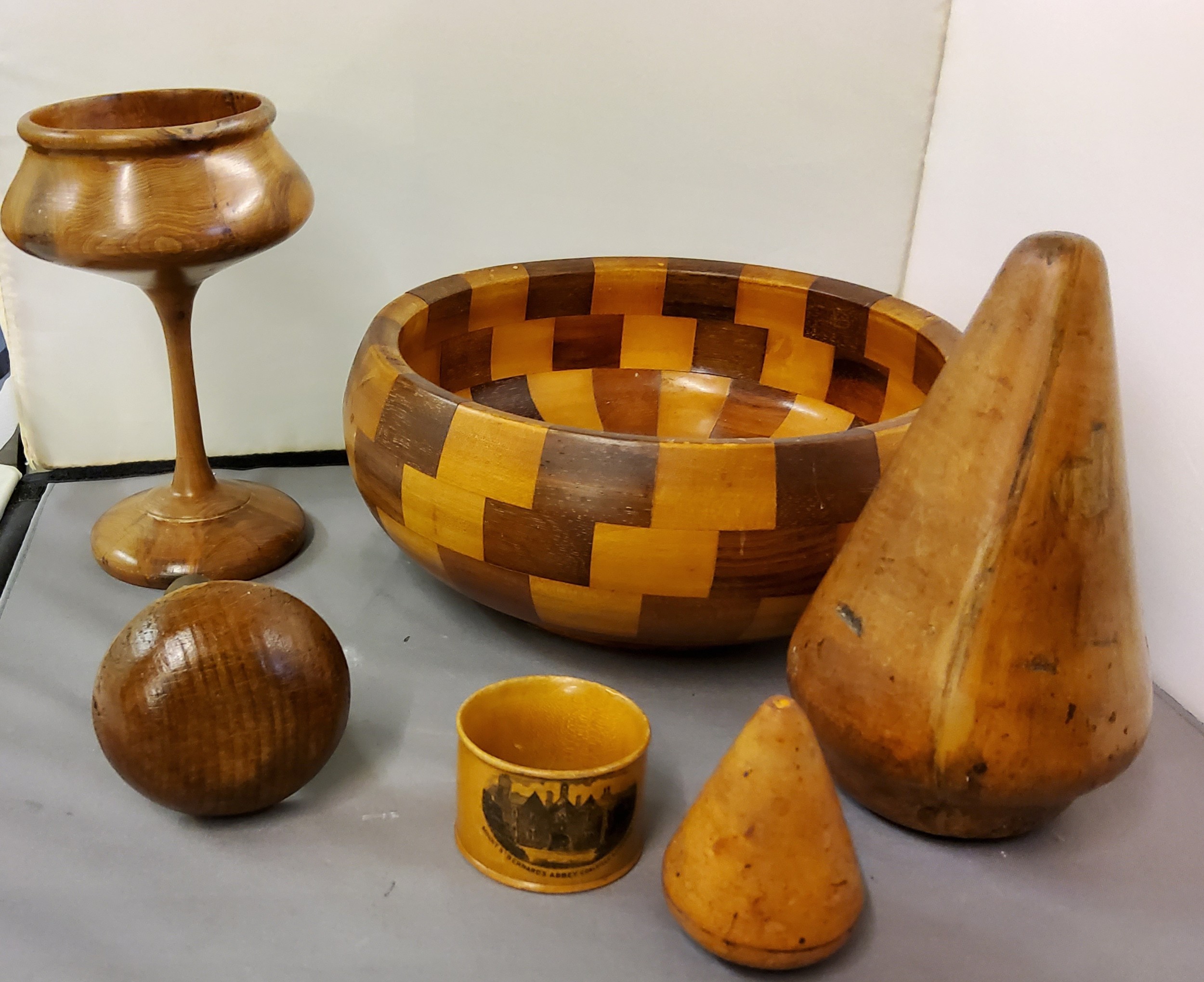 Treen - a 19th century darning mushroom;  a Machline Ware napkin ring, Mount St Bernards Abbey,