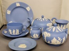 A Wedgwood Blue Jasperware bachelor's teapot, teacup, saucer and side plate. A similar sugar and