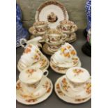 A Royal Albert tea service, for six, printed with roses, printed mark;  another, Staffordshire,