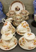 A Royal Albert tea service, for six, printed with roses, printed mark;  another, Staffordshire,