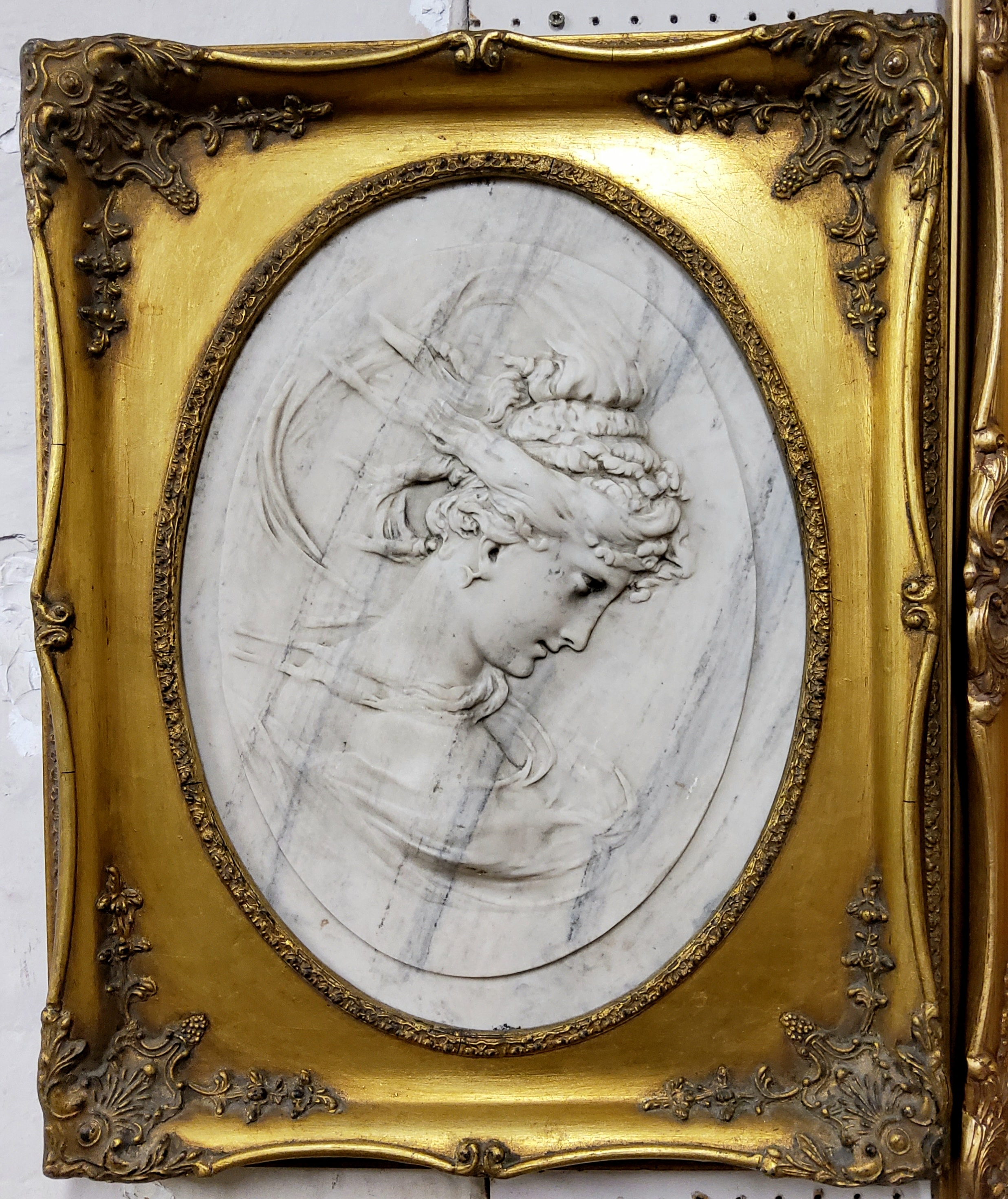 A Grand Tour type carved Carrara marble plaque of an elegant lady, bronze Louis Alexandre Bottée '