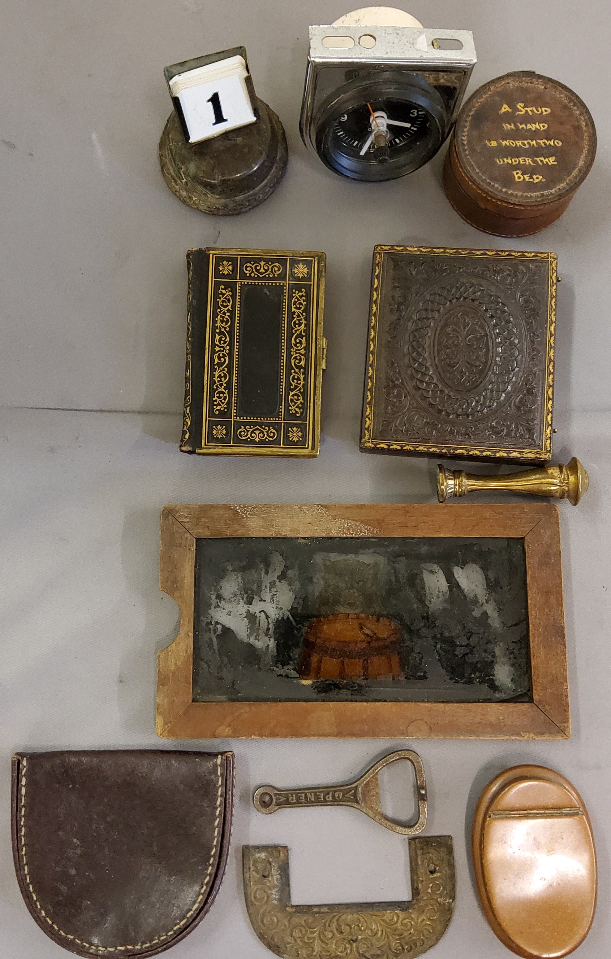 A Victorian ambrotype morocco case;  desk perpetual calendar, serpentine base;  motor vehicle dash