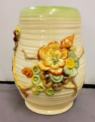A Clarice Cliff My Garden pattern vase,  in relief with flowers, on ribbed ground, 22.56cm high,