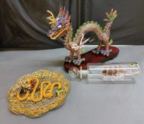 A Chinese gilt metal and cloisonne dragon, 28cm wide, a gilt metal, cloisonne and filigree plate,