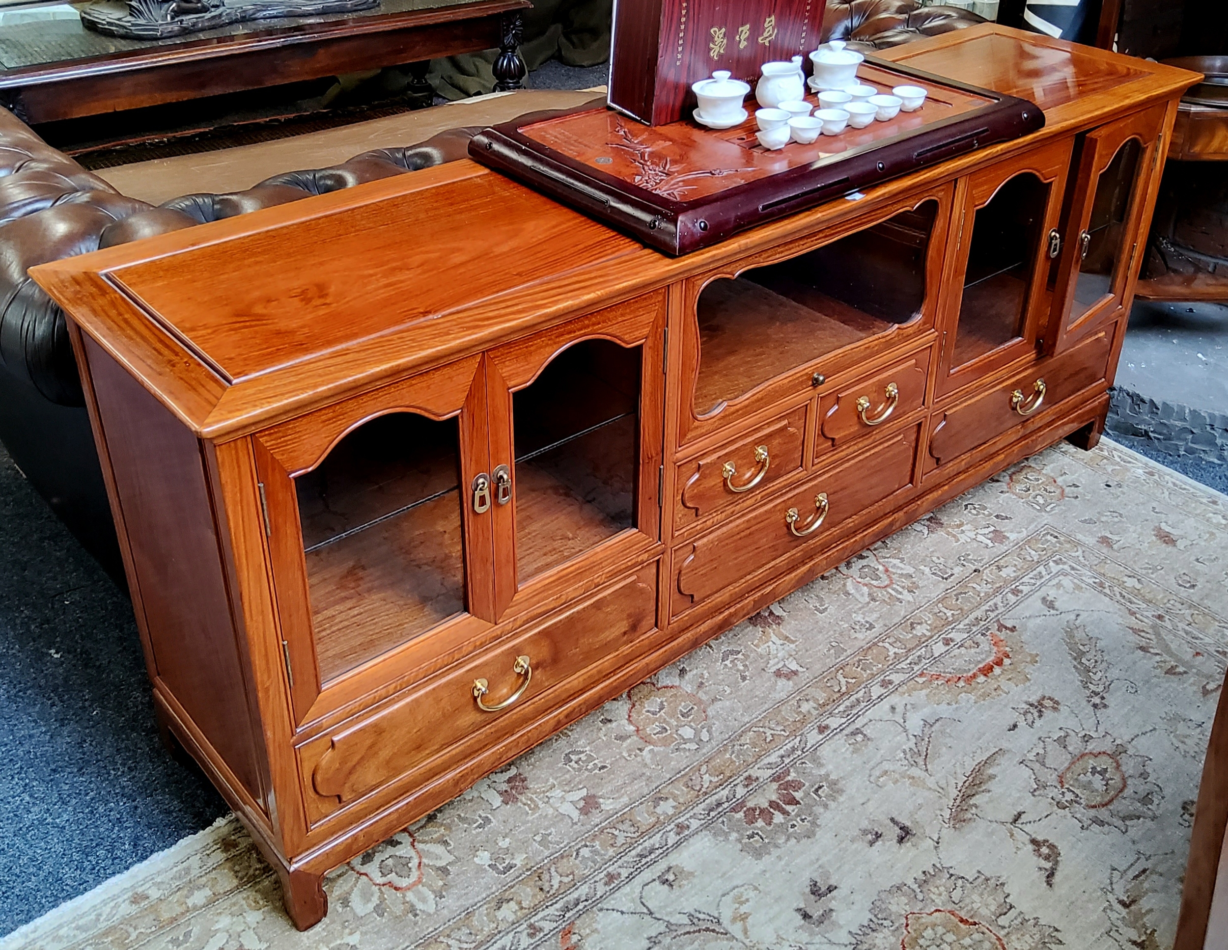 A Chinese hardwood low sideboard, very good condition.  180cm wide x 76cm high x 46cm deep