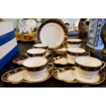 A set of six Aynsley teacups and sandwich saucers,  five further saucers and three side plates,