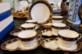 A set of six Aynsley teacups and sandwich saucers,  five further saucers and three side plates,