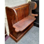 A farmhouse pine high backed box settle