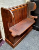 A farmhouse pine high backed box settle