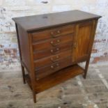 An Edwardian mahogany music side cabinet, five fall front drawers, flanked by a cupboard door,  84.5