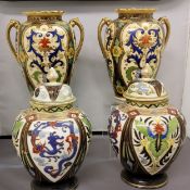 A pair of Noritake ovoid vases, decorated with cartouches, each with scrolling foliage, in blue,