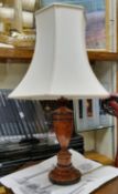 A scumbled burr effect softwood baluster table lamp with cream shade