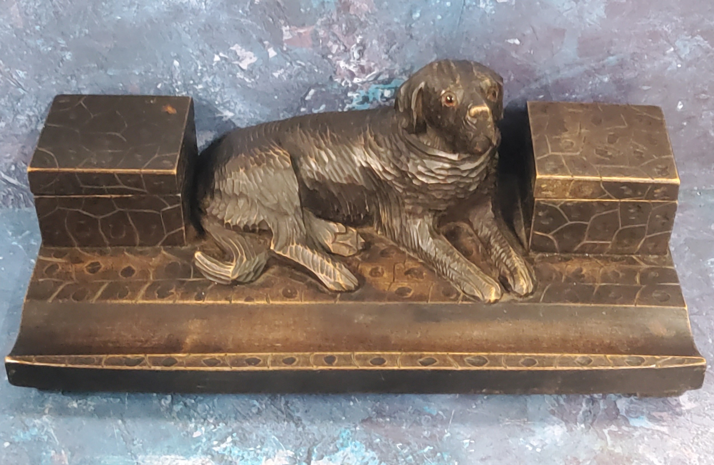 A 19th century Black Forest standish, carved with a large dog reclining between two square covered - Image 2 of 2