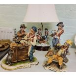 A Capo-di-Monte figural table lamp, modelled by Menegheth, of a boy, girl and hound, wooden base;