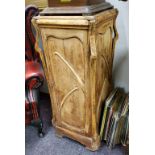 An Art Nouveau stripped pine cabinet, whiplash applied details (A/F)