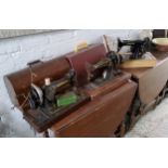 Three Singer sewing machines