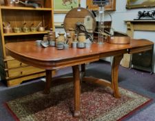 A Victorian oak draw leaf dining table with three additional leaves, (approximately 200cm in