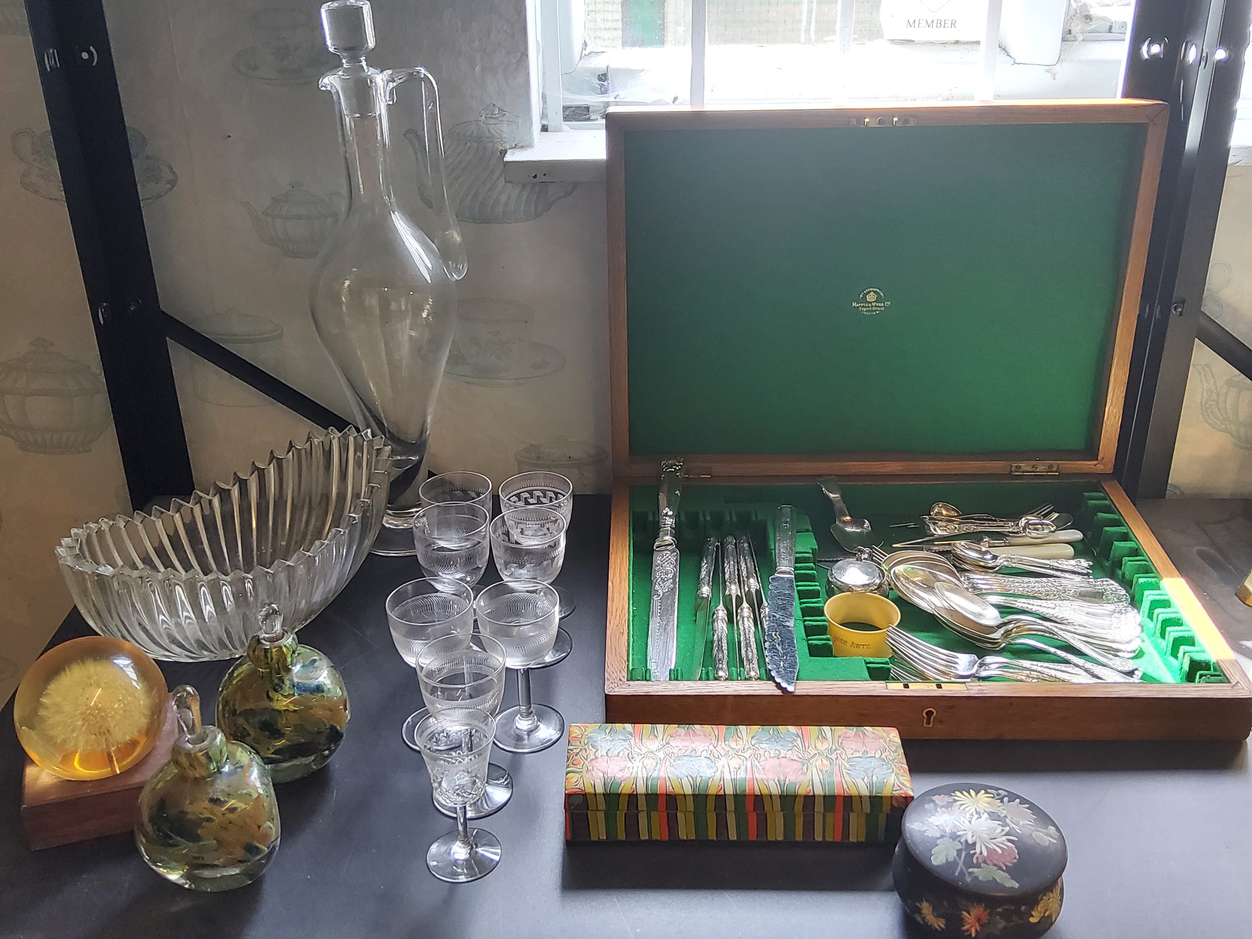 A ribbed boat shaped bowl; a slender clear glass decanter;  sherry glasses;  two Stourbridge type