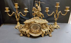 A 20th century gilt metal clock garniture, quartz clock, the case surmounted with a knight, three