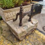 A wrought iron and Derbyshire sandstone boot scraper