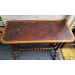 A Victorian rounded rectangular side table, leather top, bobbin turned double columns and stretcher,