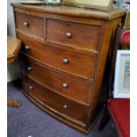 A Late Victorian bow front chest of two above three drawers, lacking feet (A/F)