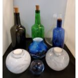 Glassware- an Art glass vase, swirled in blue;  candle night light globular vases;  coloured bottles