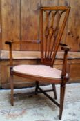 An early 20th century Arts & Crafts mahogany, satinwood, boxwood and ebony inlaid library