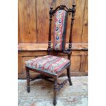 A Victorian rosewood prie dieu  side chair, tapestry upholstered back and seat, turned legs, c.1860
